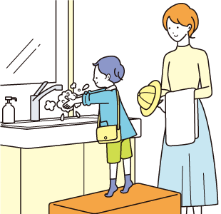 手を洗う子供と見守る母親